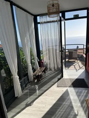 a balcony with a view of the ocean at Panoramic House in Ribeira Brava