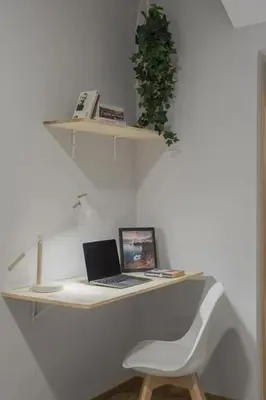 a desk with a laptop computer on top of it at Casa das Raposinhas II in Funchal