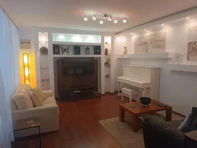 a living room with a couch and a fireplace at Reis Magos Beach Caniço Sea line Apartment in Caniço