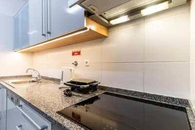 a kitchen with a sink and a counter top at Ocean View Flat in Câmara de Lobos