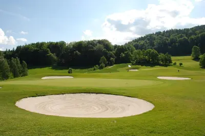 a view of a golf course with a sand bunker at Balancal Apartments and Villas Palheiro Village by Holiday Rental Madeira in Funchal