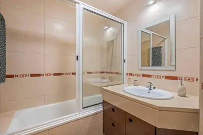 a bathroom with a sink and a shower at Ocean view Madeira in Caniço