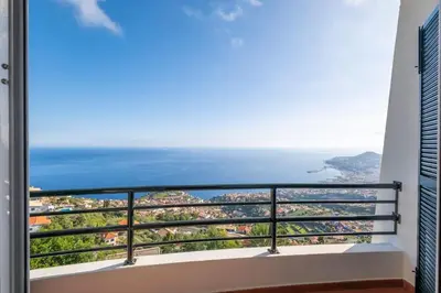 a balcony with a view of the ocean at Tucha's Apartement in Funchal