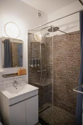a bathroom with a shower and a sink at Bela Vista Burgau in Burgau