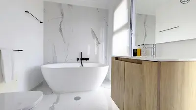 a white bathroom with a tub and a sink at Costa Vista by LovelyStay in Funchal