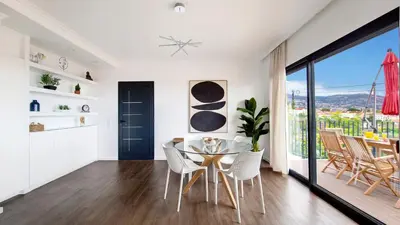 a dining room with a glass table and chairs at Costa Vista by LovelyStay in Funchal