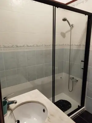a bathroom with a shower and a sink and a shower at Amar Mar in Vila do Bispo