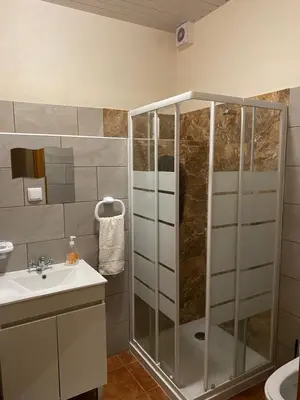 a bathroom with a shower and a sink at caminho da praia da maiata in Porto da Cruz