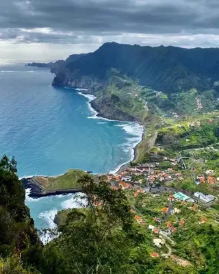 an aerial view of the ocean and a beach at caminho da praia da maiata in Porto da Cruz