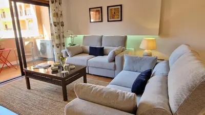 a living room with two couches and a coffee table at Luxury apartment at Baia da Luz in Luz