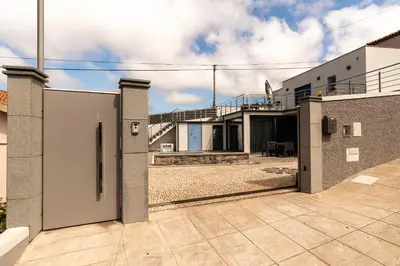 an external view of a house with a courtyard at Casa Paradiso in Arco da Calheta