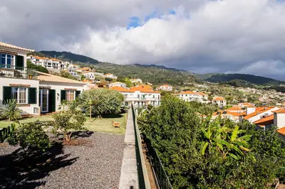 a view of a city with houses and trees at Namastê House II in Funchal