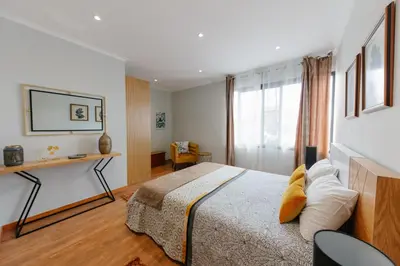 a bedroom with a bed and a window at sweet home in Caniçal