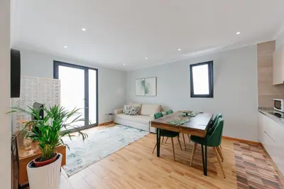 a living room with a table and a couch at sweet home in Caniçal