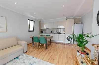 a living room with a couch and a table at sweet home in Caniçal
