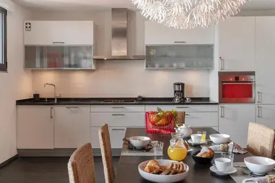 a kitchen with a table with food on it at Pipas do Avô - Seixal by An Island Apart in Porto Moniz