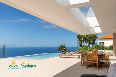 a villa with a view of the ocean at OurMadeira - Calheta Pearl in Estreito da Calheta