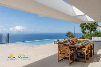 a villa with a view of the ocean at OurMadeira - Calheta Pearl in Estreito da Calheta