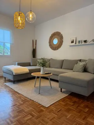 a house with a wooden door and a staircase at Casa do mar 2 bedrooms and kingsize bed in Ponta Delgada