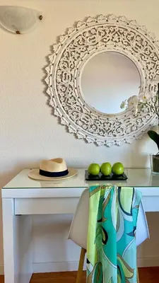 a white table with a mirror and some green apples at Casa ideal para famílias com vista mar desafogada in Funchal