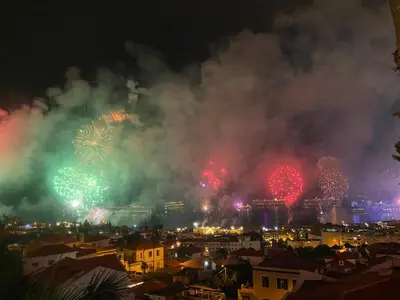 a fireworks display over a city at night at Casa ideal para famílias com vista mar desafogada in Funchal