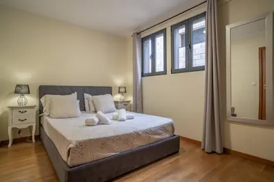 a bedroom with a bed with two pillows on it at Vista Vieira Apartments in Funchal