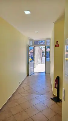 an empty hallway with a door and a tile floor at Funchal Apartments - New Botanic Garden Petit Studios in Funchal