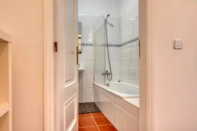 a bathroom with a shower and a bath tub at Porto Santo Pip House, a Home in Madeira in Porto Santo