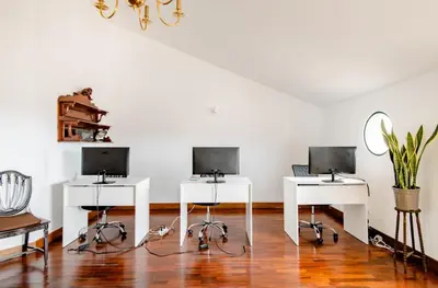 a room with three desks with computers on them at A ver o mar rooms- Funchal city center in Funchal