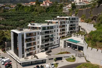 an aerial view of a large white building at Uptown 13 apartment by An Island Apart in Funchal
