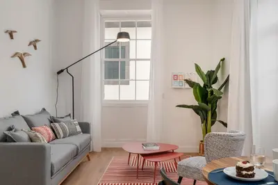 a living room with a table and chairs at Queimada Lodges by An Island Apart in Funchal