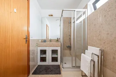 a bathroom with a shower and a sink at EDU FLAT in Machico