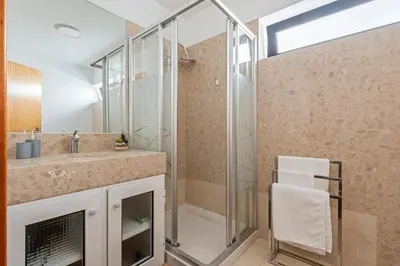 a bathroom with a shower and a sink at EDU FLAT in Machico