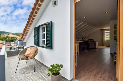 a view from the balcony of a house with a chair at Casa da Olides - Studio in Santana