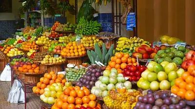a display of fruits and vegetables in a market at Ocean Paradise do Til in Funchal
