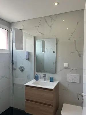 a bathroom with a sink and a shower at Ocean Paradise do Til in Funchal