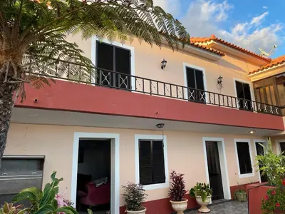 a courtyard of a house with plants and trees at Casa da Isilda ,three bedrooms in Estreito da Calheta