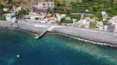 an aerial view of a beach and a road and water at Seaside Green House, Paúl do Mar T2 in Paul do Mar