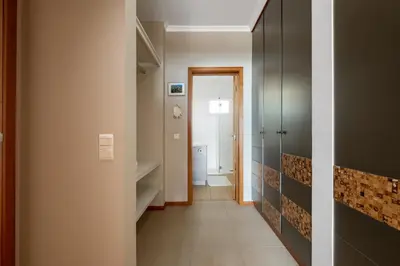 a hallway with a door and a room with a hallway at Magnolia Sunsets in Calheta