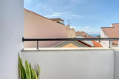 a kitchen with a sink and a stove at Beco Santa Emilia 4N, a Home in Madeira in Funchal