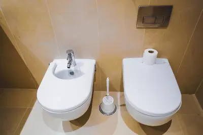 a bathroom with a toilet and a bidet at Funchal Centrum Apartment in Funchal