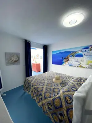 a room with a window with a view of the ocean at Casa Santorini in Ribeira Brava