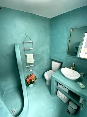 a kitchen with blue cabinets and a blue counter top at Casa Santorini in Ribeira Brava