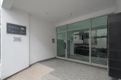 a building with a glass door with a car in the window at Apartamento Princesa Dona Amélia by An Island Apart in Funchal
