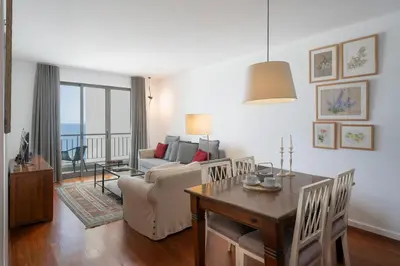a living room with a couch and a table at Apartamento Princesa Dona Amélia by An Island Apart in Funchal