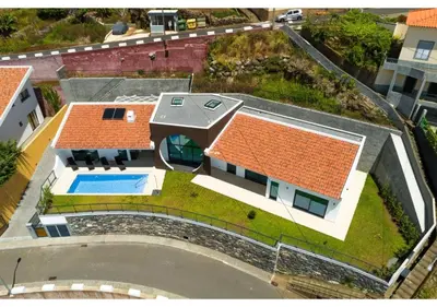 an aerial view of a house with a swimming pool at The pool house in Ponta de Sol in Funchal