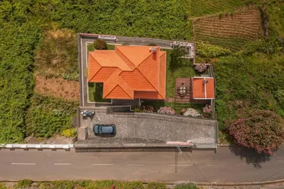 an overhead view of a house with an orange roof at Casa do Rosário by An Island Apart in São Vicente