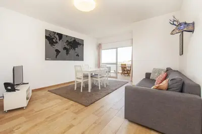 a living room with a couch and a table at B69 - Village of Luz Apartment in Luz