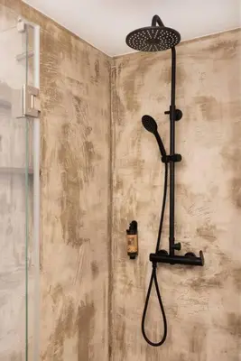 a shower with a shower head in a bathroom at Villa Belafonte in Câmara de Lobos