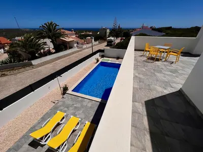a swimming pool on the roof of a house at Villa Sonata in Ingrina Sol in Raposeira